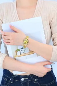 Elegant gold square women's watch with rhinestone bezel and vintage metal mesh bracelet.