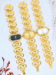 Luxury gold diamond oval quartz women watch with stylish hollow chain strap detail.