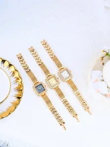 Women's square retro quartz watch with diamond bezel, luxury gold stainless steel bracelet.