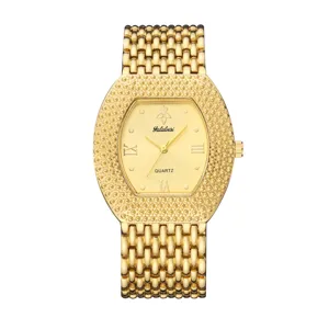 Gold tone women quartz watch featuring tonneau dial, sparkling beaded bezel and mesh bracelet.