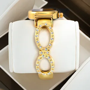 Women gold rhinestone bracelet watch, elegant luxury fashion timepiece for daily wear.