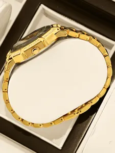 Luxury gold octagonal women watch with crystal bezel and metal link bracelet, elegant jewelry.