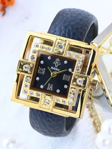 Close-up detail view of women quartz watch featuring a square gold hollow case and rhinestones.