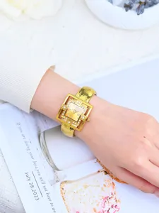 Gold square bangle quartz watch for women, stylish detail view showcasing elegant design.