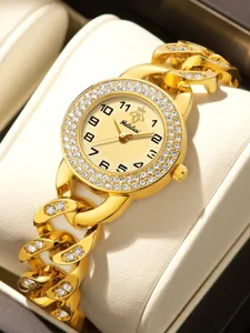 Gold rhinestone watch detail showing sparkling crystal bezel and chunky chain link bracelet.