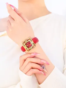 Women red strap square watch detail view, elegant gold hollow case with sparkling rhinestones.