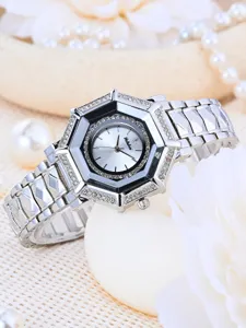 Luxury silver rhinestone octagonal women watch detail view, elegant metal link strap timepiece.