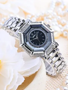 Luxury silver women's watch with rhinestone octagonal bezel and elegant metal strap.