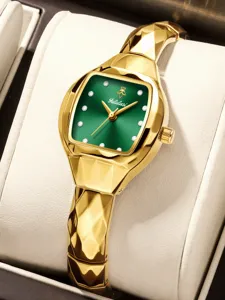 Women's luxury vintage tonneau watch with green dial, gold faceted bracelet and crystal markers.