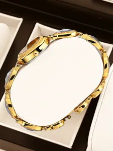 Detail view of luxury vintage gold women watch with elegant link bracelet and crystal details.