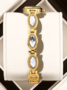 Vintage gold-tone women watch with sparkling oval crystal links elegant quartz timepiece detail