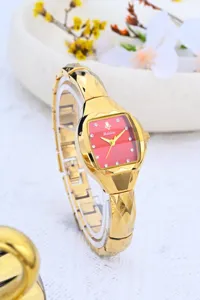 Women retro tonneau quartz watch with red dial, gold cut strap, elegant jewelry item.