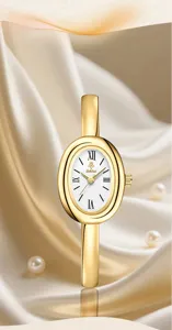 Luxury gold oval bangle watch for women, minimalist retro quartz timepiece with white dial.