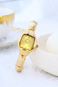 Gold tone tonneau womens quartz watch showcasing rhinestone dial and faceted metal strap details.