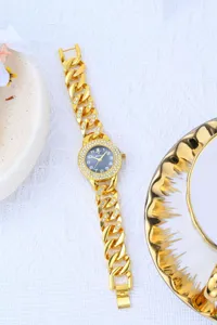 Luxury gold rhinestone chain women watch with sparkling diamonds bezel and sleek dial.