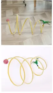 Spiral cat tunnel toy with mesh design, feathers, bells, and ball for kitten play and fun.