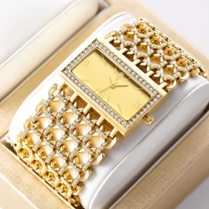 Luxus goldene Quarz Damenarmbanduhr mit Strass Steinen und edlem rechteckigen Zifferblatt.