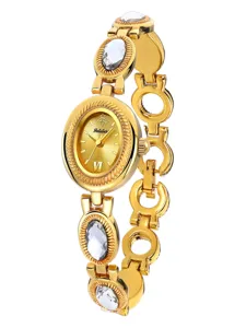 Elegant gold-tone women's quartz watch with crystal accents and classic oval dial design.