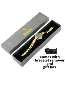 Luxury gold tonneau quartz watch with green dial, geometric bracelet, gift box and tool.