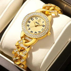 Luxury gold women rhinestone watch with chain strap sparkling diamond bezel quartz timepiece.
