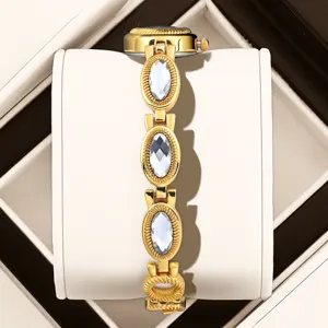 Elegant gold women's watch with vintage oval crystal links, luxury fashion timepiece for daily wear.