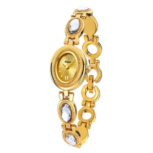 Gold tone vintage oval dial women quartz watch with crystal stone bracelet links main view