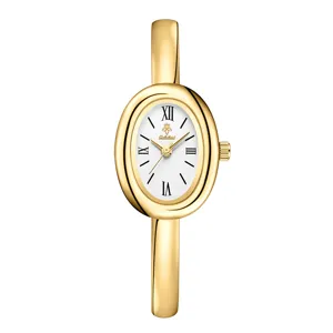 Gold oval bangle quartz watch for women vintage minimalist timepiece with Roman numerals
