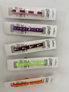 Detailed shot of pet collars for cats and dogs with cute paw and bone patterns and small bells.