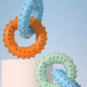 Detail view of colorful interlocking pet chew rings with textured spikes for dog teeth cleaning.