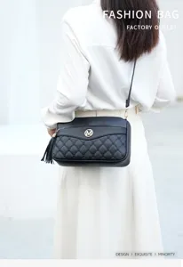 Black quilted crossbody shoulder bag with stylish tassel and metal M logo for women