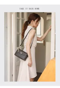 Vintage monogram crossbody bag for women, stylish leather shoulder bag with retro pattern.