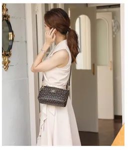 Vintage women monogram crossbody bag with metallic clasp detail for daily casual wear style