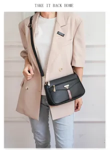 Black soft leather crossbody shoulder bag for women with chic hardware and striped strap detail.