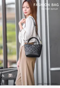 Stylish black quilted leather handbag with top handles and strap for women daily wear.