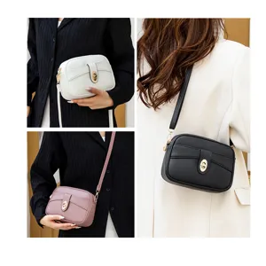 Minimalist women's crossbody bag featuring clean solid color and chic metal turn-lock detail.