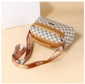 Women stylish crossbody shoulder bag with spacious compartments and patterned strap.