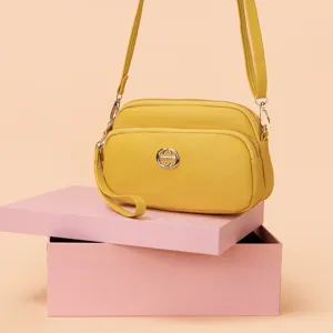 Women yellow crossbody bag PU leather shoulder handbag with double zipper and stylish metal decor