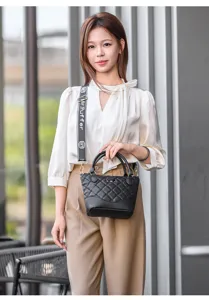 Fashion quilted shoulder bag for women, versatile PU leather handbag with wide strap design.