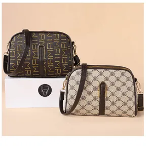 Detailed view of retro monogram mini cross body bags featuring adjustable straps and gold hardware.