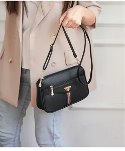 Close-up of soft leather texture and fine metal details on the classic shoulder bag.