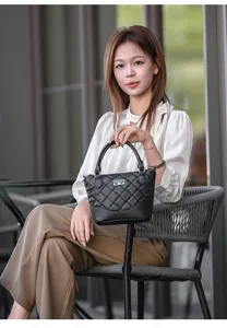 Elegant black quilted handbag for women, spacious tote with durable top handles and chic design.