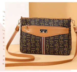 Chic women's vintage monogram crossbody bag with stripe detail and shoulder strap.