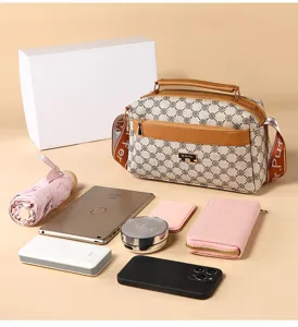 Stylish women shoulder cross body bag with spacious capacity and chic monogram pattern design.