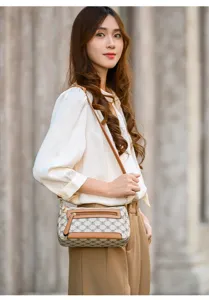 Vintage retro monogram shoulder bag for women, stylish crossbody handbag with brown trim.