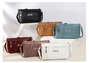 Borsa a tracolla elegante da donna con motivo coccodrillo, fiocco chic e tasche.