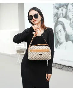 Stylish women shoulder crossbody bag with classic monogram print, brown leather trim, large capacity.