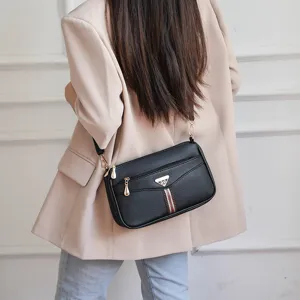 Stylish women's leather crossbody bag, soft casual shoulder bag with multiple zipper pockets.