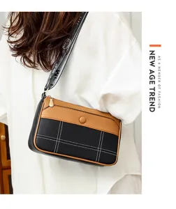 Stylish women's crossbody shoulder bag, black and brown colorblock design with wide strap.