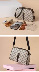 Vintage monogram crossbody bag for women, stylish retro PU leather shoulder bag.