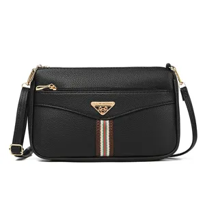 Black soft leather crossbody bag for women, classic shoulder purse with strap and metal logo.